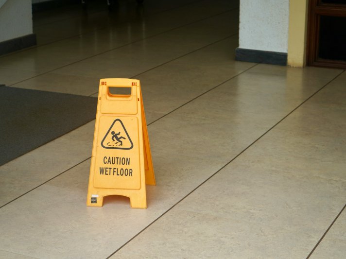 Clean Commercial Tile Floor with Caution Sign in South Dakota
