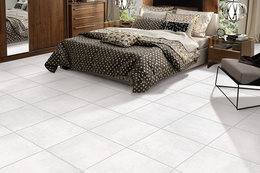 Light tile floors in a bedroom