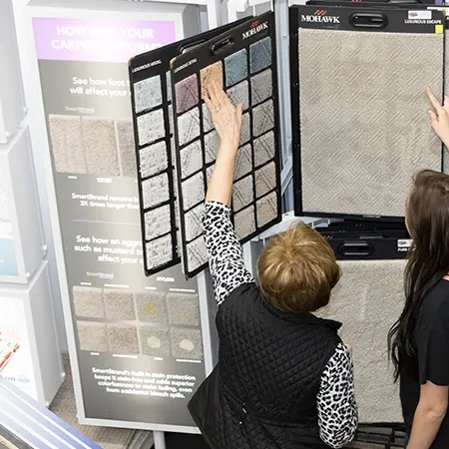 Customers checking out carpet samples