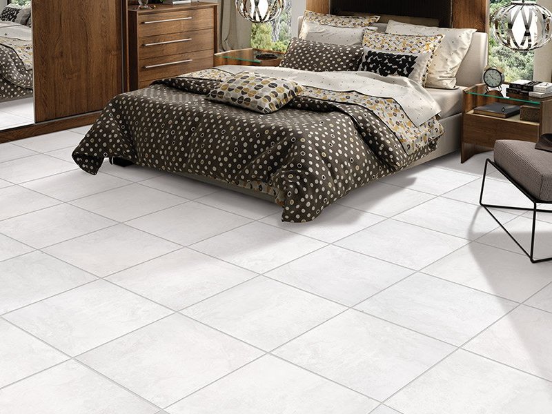 Light tile floors in a bedroom