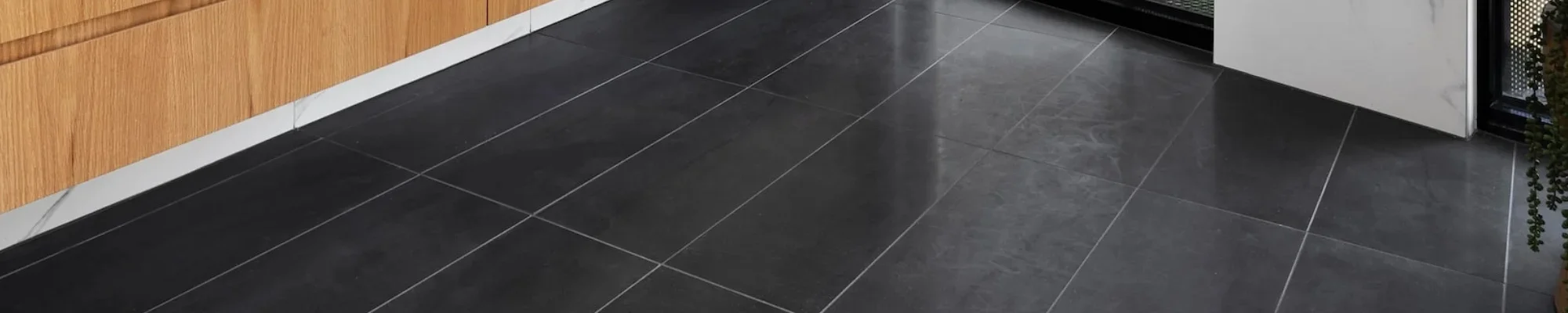 Dark tile in a modern bathroom | Altimate Flooring | Rapid City, SD